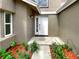 Welcoming front door with sidelight, enhanced by stylish landscaping at 721 Rock Creek Loop, Longwood, FL 32750