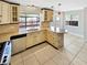 Bright kitchen featuring tile floors and modern appliances at 721 Rock Creek Loop, Longwood, FL 32750