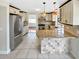 Stylish kitchen with stainless steel appliances, granite countertops, and tile backsplash at 721 Rock Creek Loop, Longwood, FL 32750
