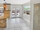 Bright eat-in kitchen features granite countertops, white cabinets, and tiled floors at 721 Rock Creek Loop, Longwood, FL 32750