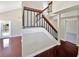 Staircase with wood and black metal banister and wood flooring at 721 Rock Creek Loop, Longwood, FL 32750