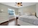 Light-filled bedroom with stylish décor, a dedicated desk area, and a comfortable bed and furnishings at 7549 Lake Marsha Dr, Orlando, FL 32819