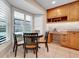Eat-in kitchen featuring a sun-filled breakfast nook, custom cabinetry, and a built-in coffee bar area at 7549 Lake Marsha Dr, Orlando, FL 32819