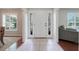 Bright foyer featuring a white door with sidelights and tile flooring at 7549 Lake Marsha Dr, Orlando, FL 32819