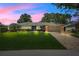 Charming single-story home with lush landscaping, brick accents, and a paver driveway at 7549 Lake Marsha Dr, Orlando, FL 32819