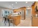 Spacious kitchen with island, stainless steel appliances, and breakfast bar seating at 7549 Lake Marsha Dr, Orlando, FL 32819
