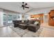 Open concept living space with access to outdoor pool area, with a kitchen and living room at 7549 Lake Marsha Dr, Orlando, FL 32819