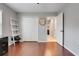 Bright office with hardwood floors, a closet, and a ladder style shelving unit at 7549 Lake Marsha Dr, Orlando, FL 32819