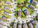 Aerial view of a private pool and a residential house, in a neighborhood with well-manicured lawns at 7739 Graben St, Kissimmee, FL 34747