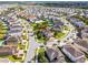 Wide aerial shot outlining the property, showcasing its mature landscaping, and premier location in a desirable neighborhood at 7739 Graben St, Kissimmee, FL 34747