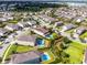 Expansive aerial view of a community featuring the property with a large pool and outdoor area at 7739 Graben St, Kissimmee, FL 34747
