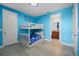 Charming bedroom featuring a bunk bed and whimsical nautical-themed decor at 7739 Graben St, Kissimmee, FL 34747