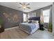 The bedroom features an eye-catching world map wall decor and wood laminate flooring at 7739 Graben St, Kissimmee, FL 34747