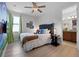 Bright bedroom with Super Mario mural wall and door that leads into the primary bathroom at 7739 Graben St, Kissimmee, FL 34747