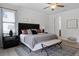 Spacious bedroom features luxury vinyl floors, ceiling fan, and walk-in closet at 7739 Graben St, Kissimmee, FL 34747