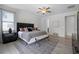 Spacious bedroom features luxury vinyl floors, ceiling fan, and walk-in closet at 7739 Graben St, Kissimmee, FL 34747