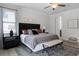 Spacious bedroom features luxury vinyl floors, ceiling fan, and walk-in closet at 7739 Graben St, Kissimmee, FL 34747