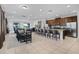 Expansive open-concept layout with a modern kitchen, dining area, and living space for seamless entertaining at 7739 Graben St, Kissimmee, FL 34747