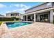 Backyard showcasing a pool, patio, and outdoor seating, perfect for entertaining and relaxation at 7739 Graben St, Kissimmee, FL 34747
