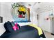 Bedroom with closet doors and custom Mickey Mouse mural at 8187 Roseville Rd, Davenport, FL 33896
