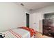 Cozy bedroom featuring a single bed, dresser, and closet, perfect for a or guest at 8187 Roseville Rd, Davenport, FL 33896
