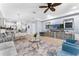 Open-concept living area with modern decor, a ceiling fan, and a view to the kitchen at 8187 Roseville Rd, Davenport, FL 33896