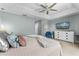 Cozy main bedroom with ample natural light, a ceiling fan, and a neutral color palette at 8187 Roseville Rd, Davenport, FL 33896