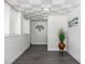 Bright hallway with modern flooring, fresh white walls, and stylish decor accents at 88 E Charlotte Ave, Eustis, FL 32726
