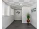 Hallway featuring wood-look flooring, a decorative ceiling, and tasteful wall decor at 88 E Charlotte Ave, Eustis, FL 32726