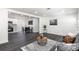 Cozy living room with stylish furniture, open to the dining area and modern kitchen at 88 E Charlotte Ave, Eustis, FL 32726