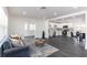 Open-concept living room flowing into a bright kitchen with modern finishes and fixtures at 88 E Charlotte Ave, Eustis, FL 32726