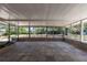 A large screened patio with a tile floor and natural light at 88 E Charlotte Ave, Eustis, FL 32726
