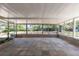 Enclosed patio features glass windows, colorful tiling, and backyard view at 88 E Charlotte Ave, Eustis, FL 32726