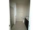 Bathroom features a glass-enclosed shower, dark vanity, and tile flooring at 8933 Hinsdale Heights Dr, Polk City, FL 33868
