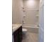 Standard bathroom featuring a vanity with dark cabinets and a shower/tub combo at 8933 Hinsdale Heights Dr, Polk City, FL 33868