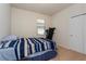 Cozy bedroom with natural light, a closet, and carpet flooring at 8933 Hinsdale Heights Dr, Polk City, FL 33868