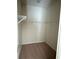 Walk-in closet with shelves for ample storage and organization at 8933 Hinsdale Heights Dr, Polk City, FL 33868