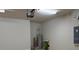 Spacious garage with block walls, bright lighting, and water heater at 8933 Hinsdale Heights Dr, Polk City, FL 33868