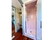 Pink tiled shower with glass doors and vintage vanity at 900 Carlton Ave, Lake Wales, FL 33853