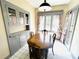 Cozy dining room with built-in cabinets, dining table, and backyard views at 900 Carlton Ave, Lake Wales, FL 33853