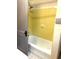 This is a shower with yellow tile and an open door at 900 Carlton Ave, Lake Wales, FL 33853