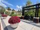 This is a town square with flowers, benches and a grassy lawn at 900 Carlton Ave, Lake Wales, FL 33853