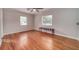 Spacious bedroom featuring hardwood floors and two windows offering natural light at 915 Oregon St, Orlando, FL 32803