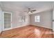 Sunlit bedroom with hardwood floors and a view of the outdoors at 915 Oregon St, Orlando, FL 32803