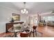 Bright dining room features hardwood floors, chic lighting, and an open layout to the living room at 915 Oregon St, Orlando, FL 32803