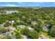 Scenic aerial view of a residential neighborhood with tree-lined streets, lakes, and well-maintained homes at 927 Boardman St, Orlando, FL 32804