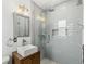 Modern bathroom featuring a sleek glass shower, stylish vanity, and contemporary fixtures at 927 Boardman St, Orlando, FL 32804