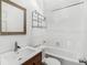 Bright bathroom featuring tiled shower, modern vanity, and ample lighting at 927 Boardman St, Orlando, FL 32804