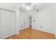 Bright bedroom featuring hardwood floors, neutral paint, ceiling fan, and closet at 927 Boardman St, Orlando, FL 32804