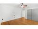 Bright bedroom featuring hardwood floors, neutral paint, ceiling fan, and closet at 927 Boardman St, Orlando, FL 32804